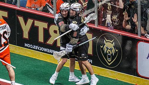 Two Albany FireWolves team mates hugging on the field